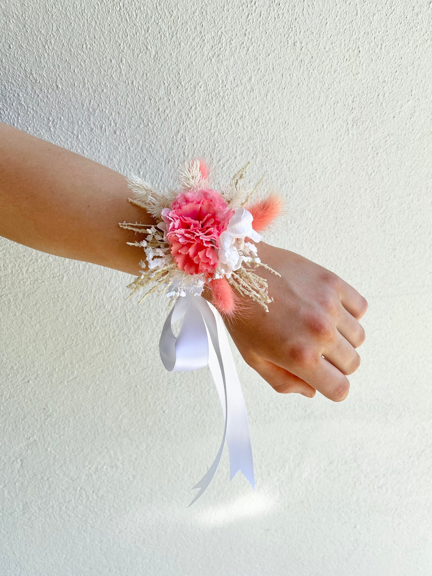 Corsage - Coral Carnations on Preserved Foliage